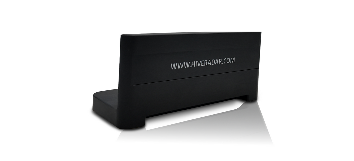 A black plastic slot cover on an angle displaying the white text 'WWW.HIVERADAR.COM'
